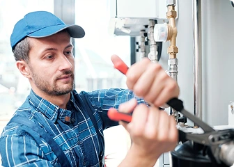 Professional plumber performing maintenance