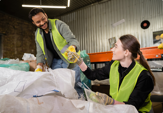 Two bulk refuses service workers clearing out waste
