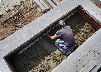 Professional concrete service worker performing concrete services
