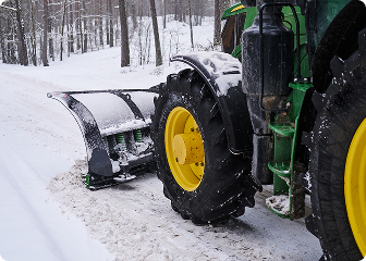 Commercial grade snow plow vehicle at work