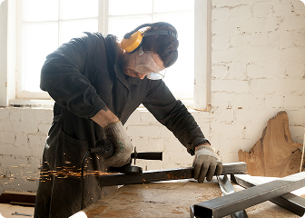 Contemporary welding and carpentry professional at work