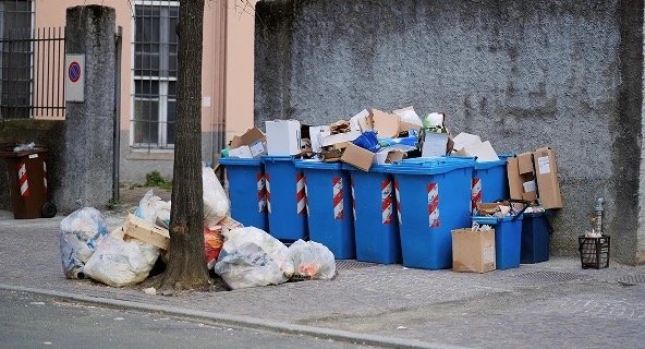 Large debris sticking out of trashbins before bulk refuse service