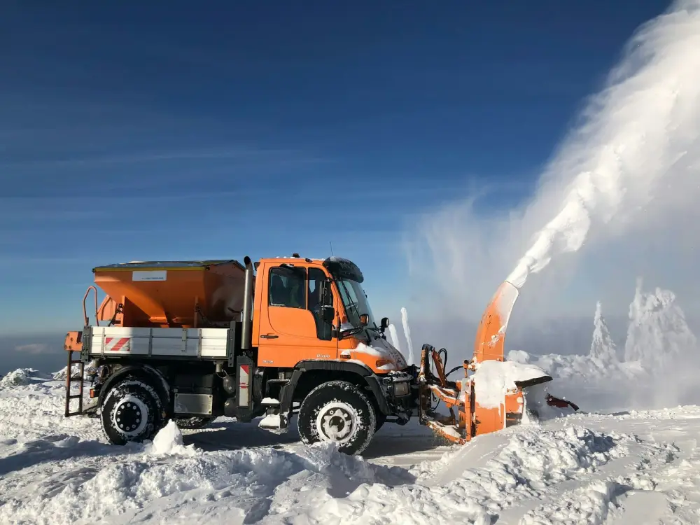 Commercial snow removal truck with spreader working in Raleigh, NC